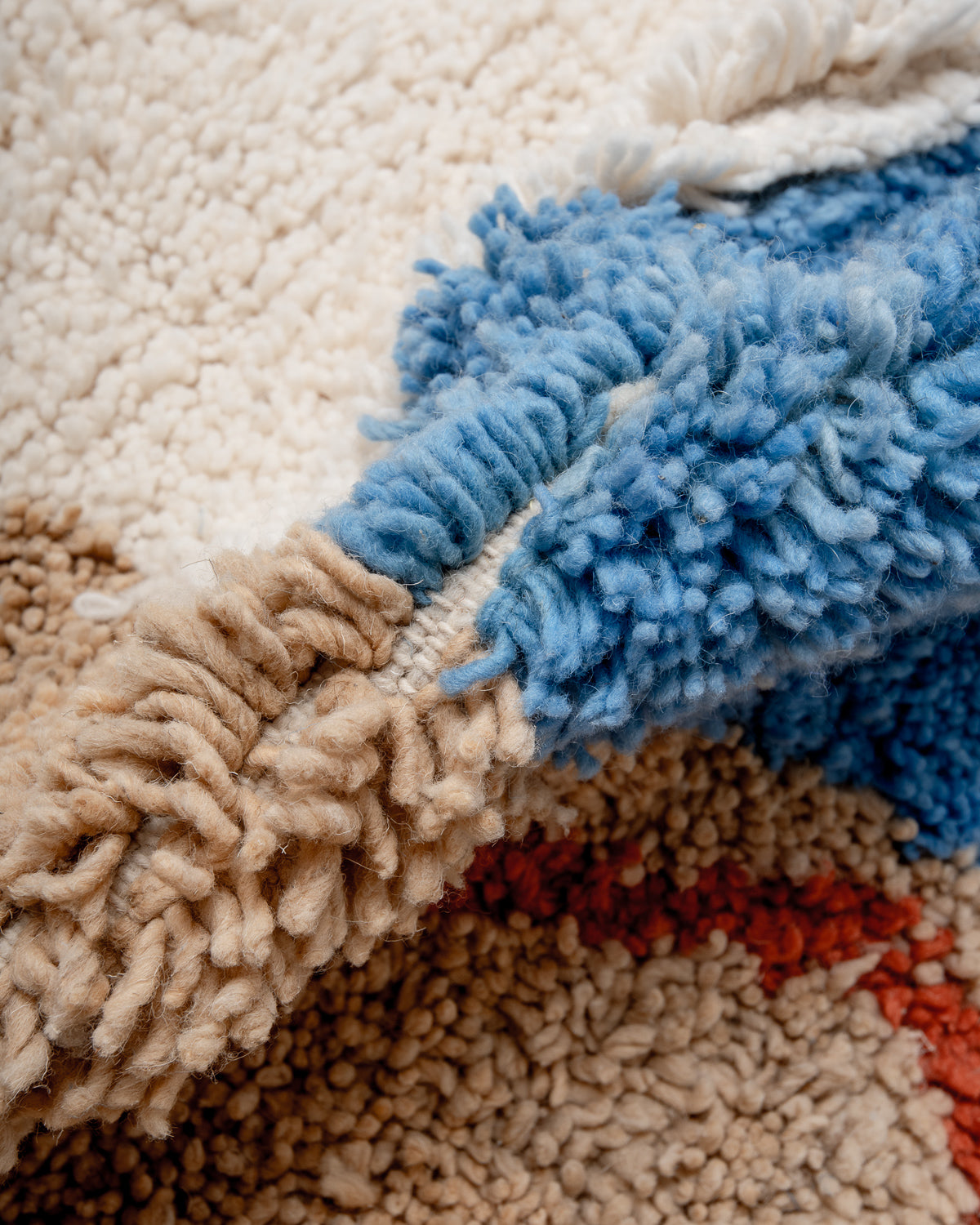 Modern, designer, handcrafted Berber rug from Morocco. Beniourain carpet with beautiful colours and patterns and fluffy wool texture.